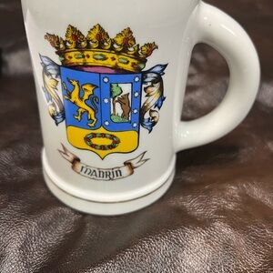 White Mug with Colorful Crest Design